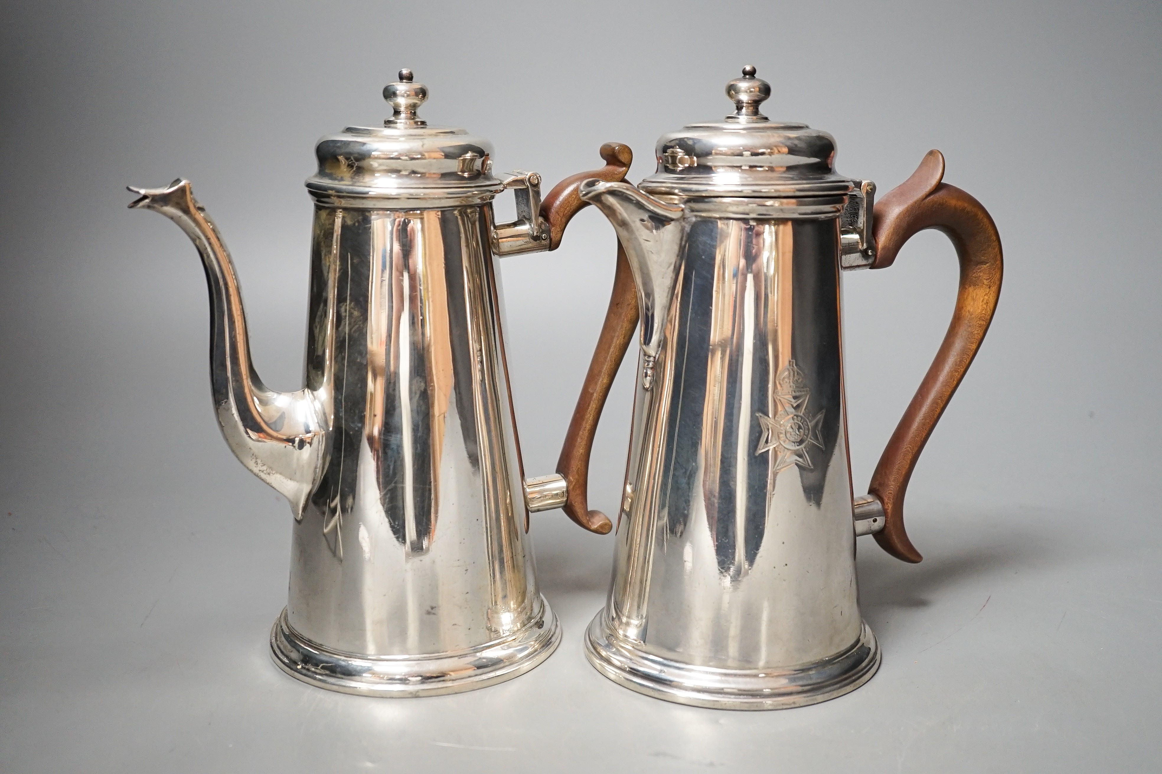 A George V cafe au lait pair, by Tessiers Ltd, London, 1924, engraved with Rifle Brigade crest, height 19.4cm, gross 33oz.